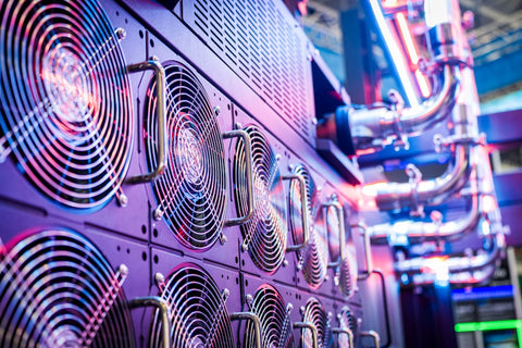 Close-up of server cooling fans in a vibrant data center